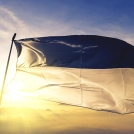 Fribourg canton of Switzerland flag textile cloth fabric waving on the top sunrise mist fog