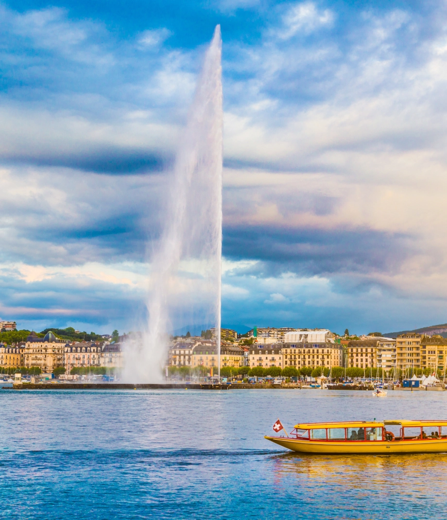 City of Geneva with Jet d'Eau fountain at sunset, Switzerland